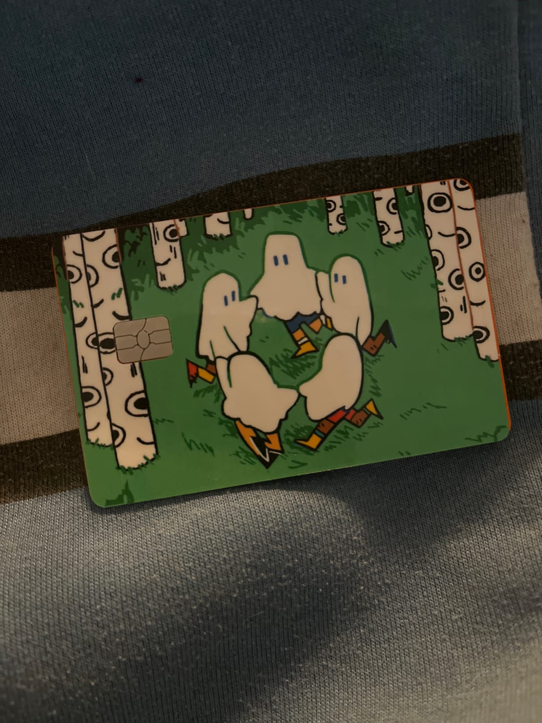 Customer photo review of Circle Ghosts Credit Card Skins