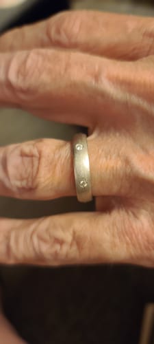 Customer photo review of Flush Set Moissanite Matte Brush Eternity Wedding Band