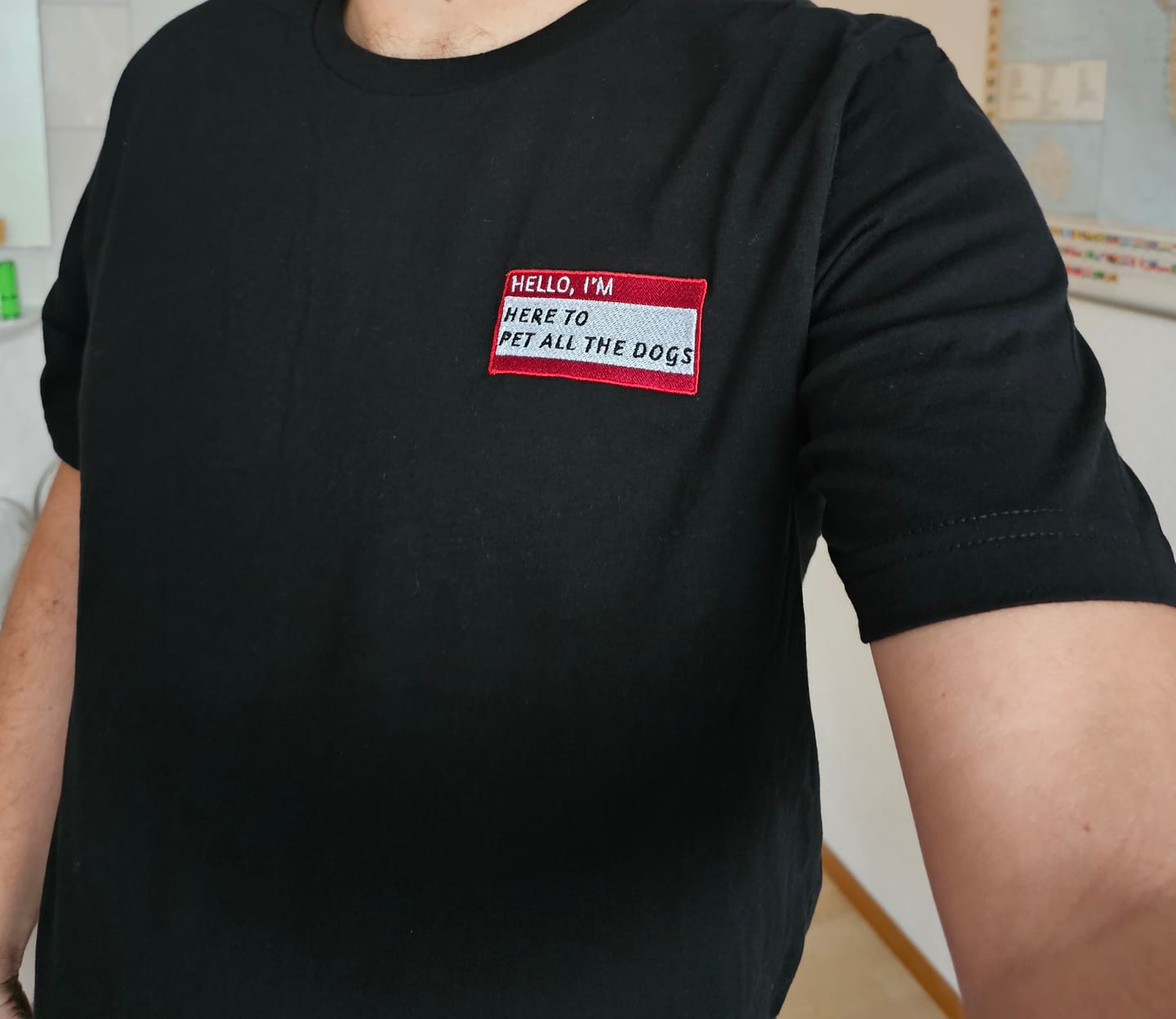 Customer photo review of HELLO I'M HERE TO PET ALL THE DOGS - Name Tag T-Shirt