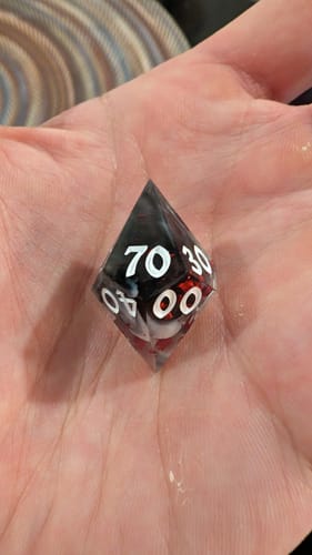 Customer photo review of Smoke And Blood Handmade Resin Dice Set RPG Game DND MTG Tabletop Gaming
