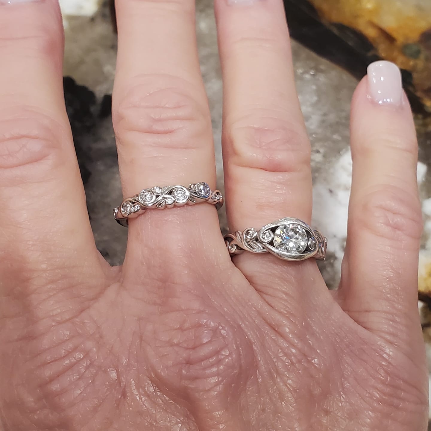 Customer photo review of Bezel Set Round Moissanite Scroll Accents Wedding Band Ring In Sterling Silver