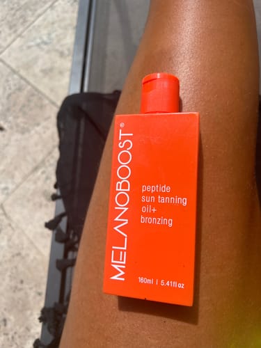 Customer photo review of Melanoboost Peptide Sun Tanning Oil + Bronzing