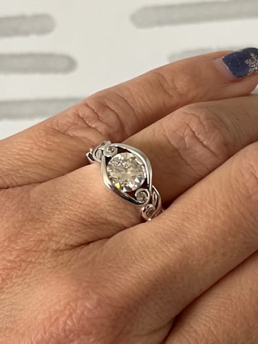 Customer photo review of Bezel Set Round Moissanite Scroll Accents Engagement Ring