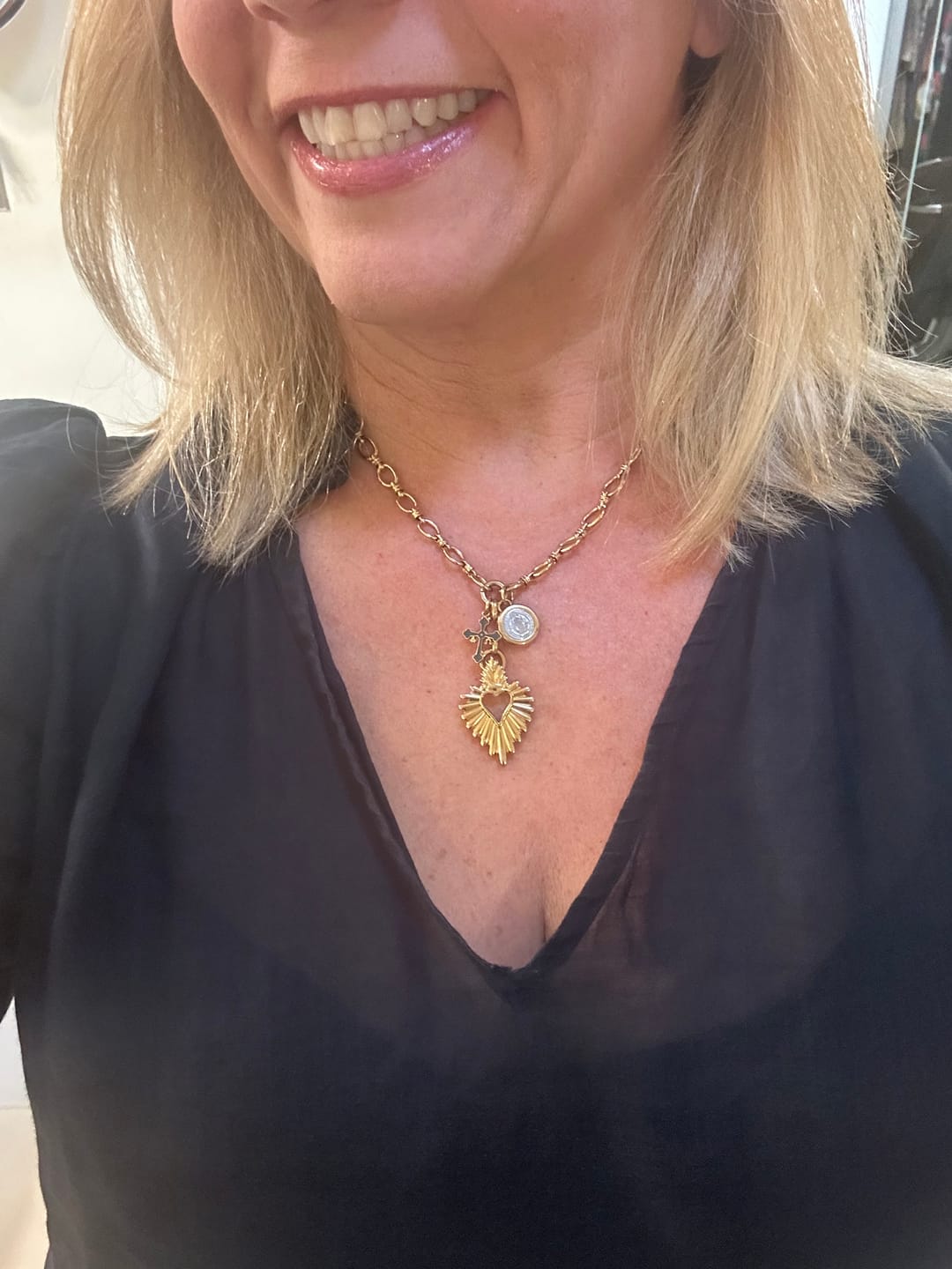 Customer photo review of DETENTE Multi Charm Necklace
