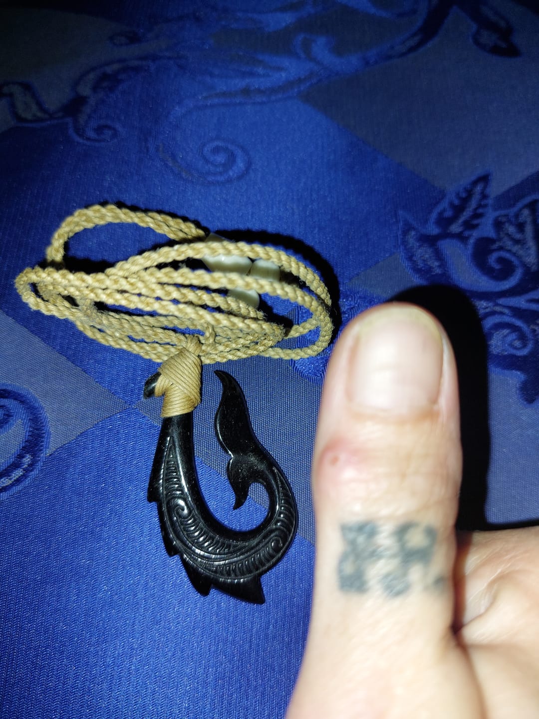 Customer photo review of Maori Black Bone Fish Hook Necklace