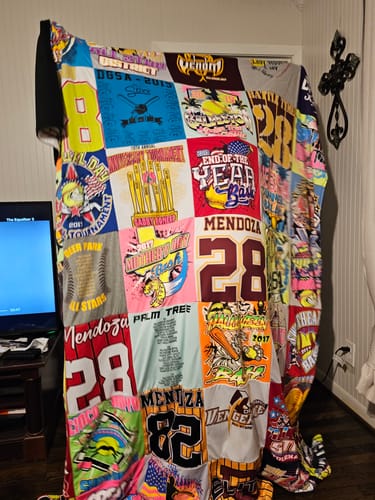 T-shirt quilt with sports, celebrations themes by MELANIE from TX