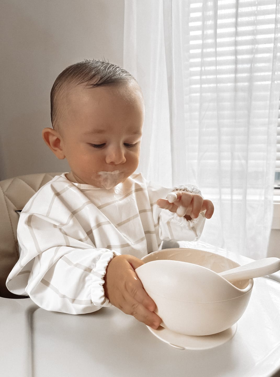 Customer photo review of Mess-Free Smock Bib | Beige Stripe