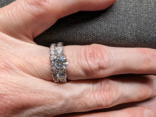 Customer photo review of Alternating Round And Princess Cut Moissanite Bezel Set Half Eternity Wedding Band