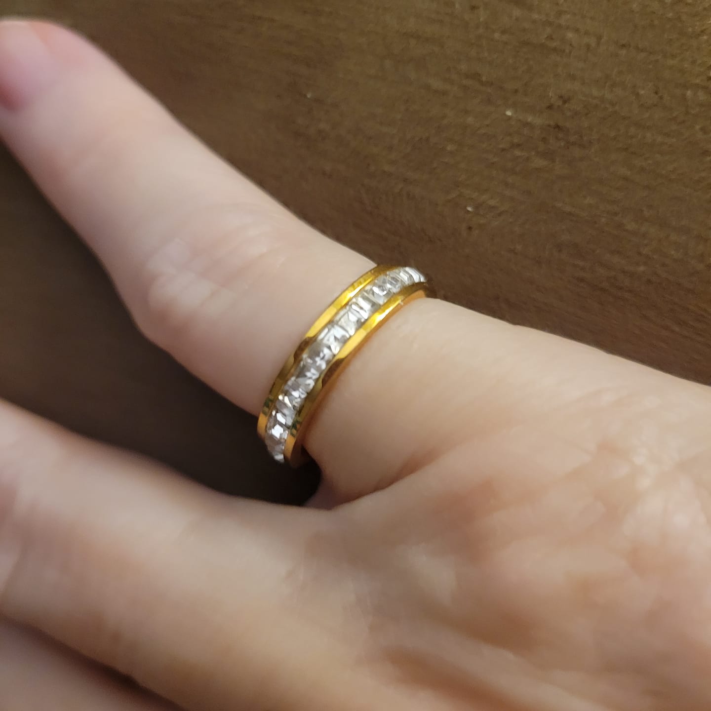 Customer photo review of 4MM 14k Gold Princess Cut Women's Eternity Titanium Ring Wedding Band with CZ