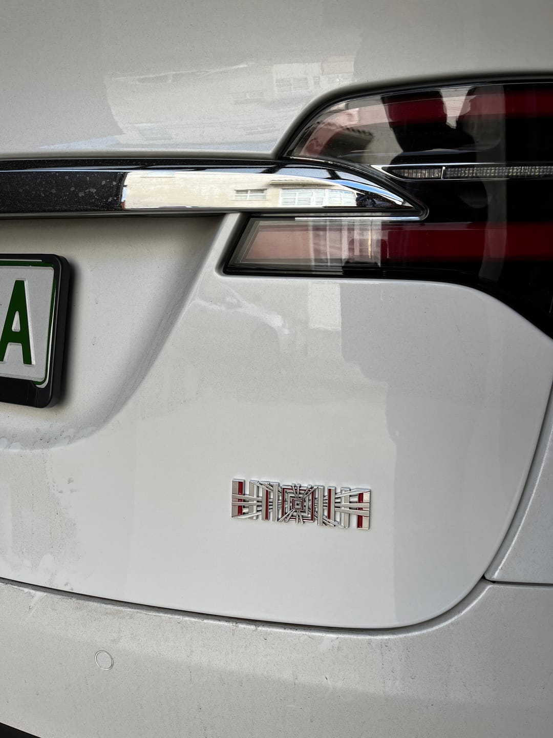 Customer photo review of PLAID EMBLEM TRUNK BADGE FOR TESLA