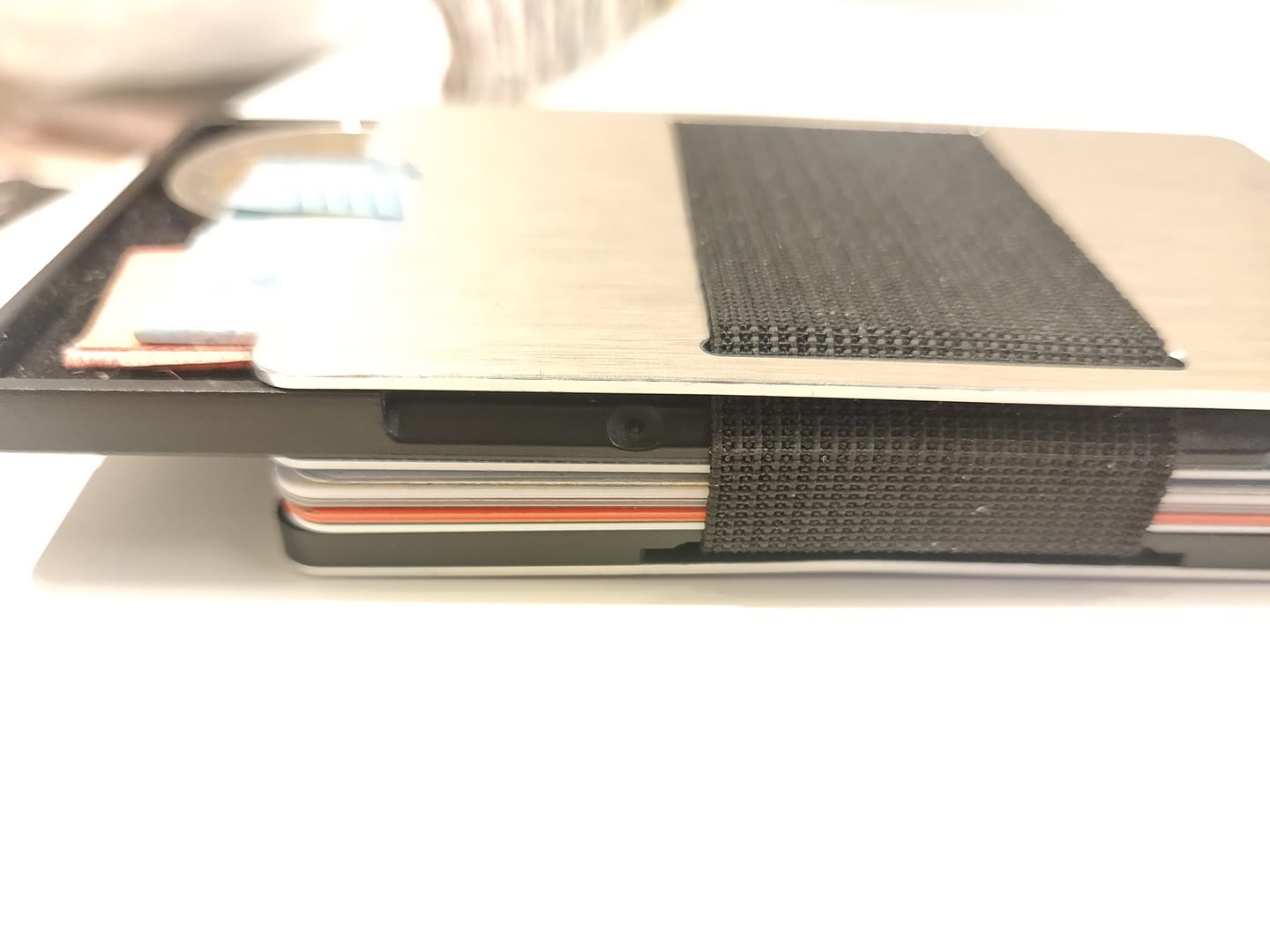 Customer photo review of NOT FLAW[LESS] Brushed Silver Aluminum Slim Wallet