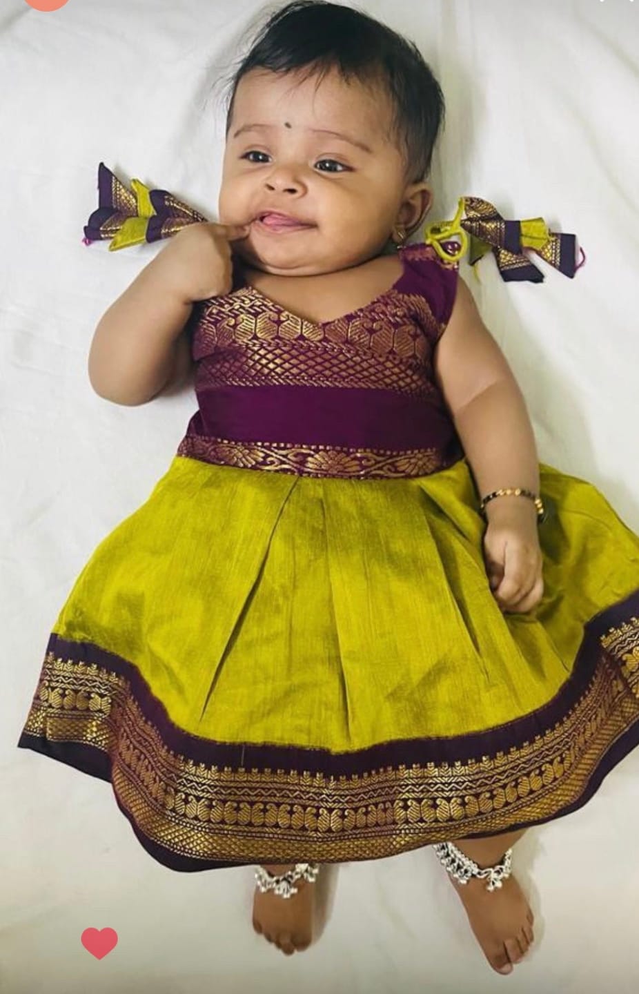 Customer photo review of Green and wine tie up dress for baby girl