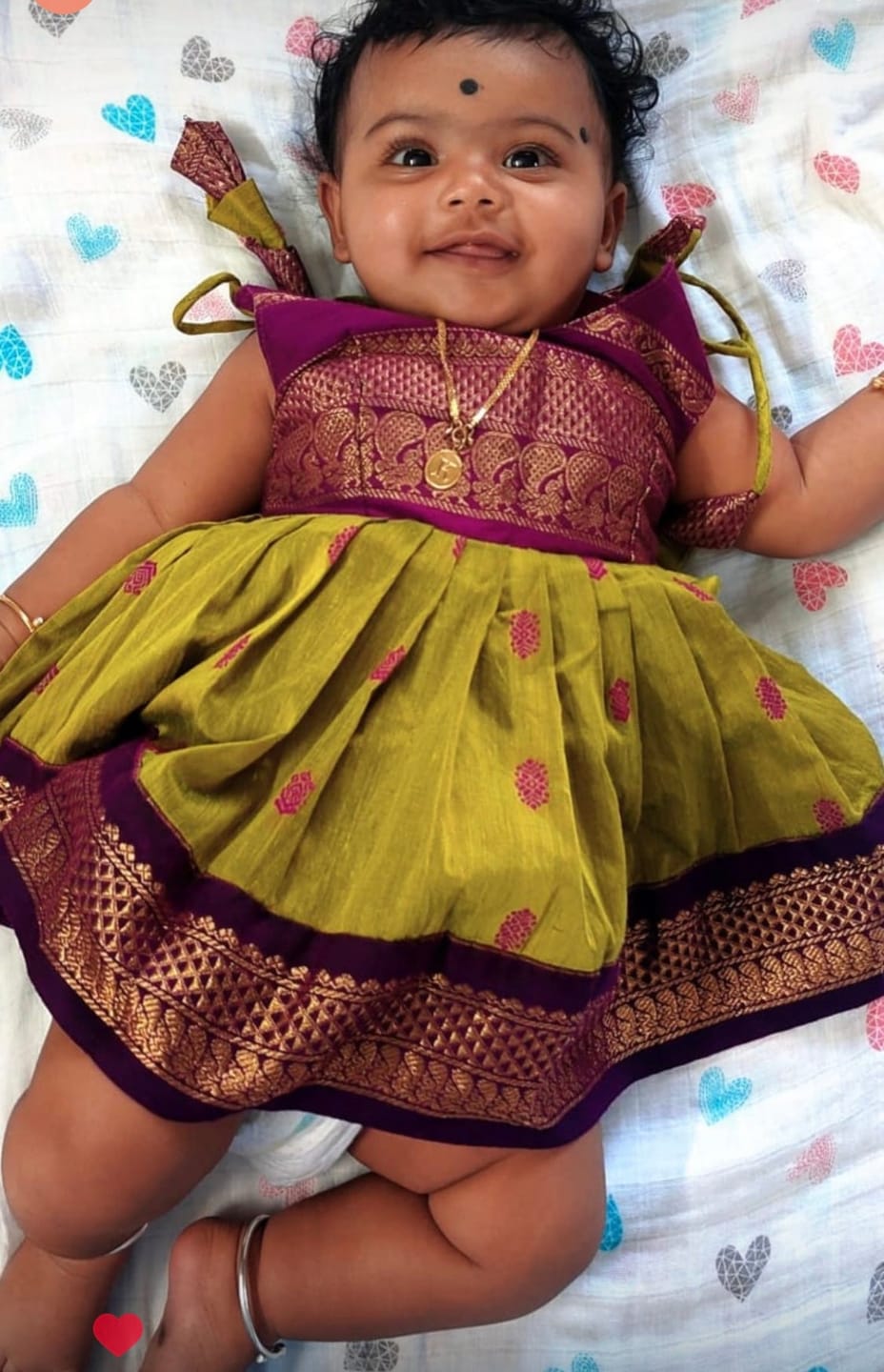 Customer photo review of Green and wine tie up dress for baby girl