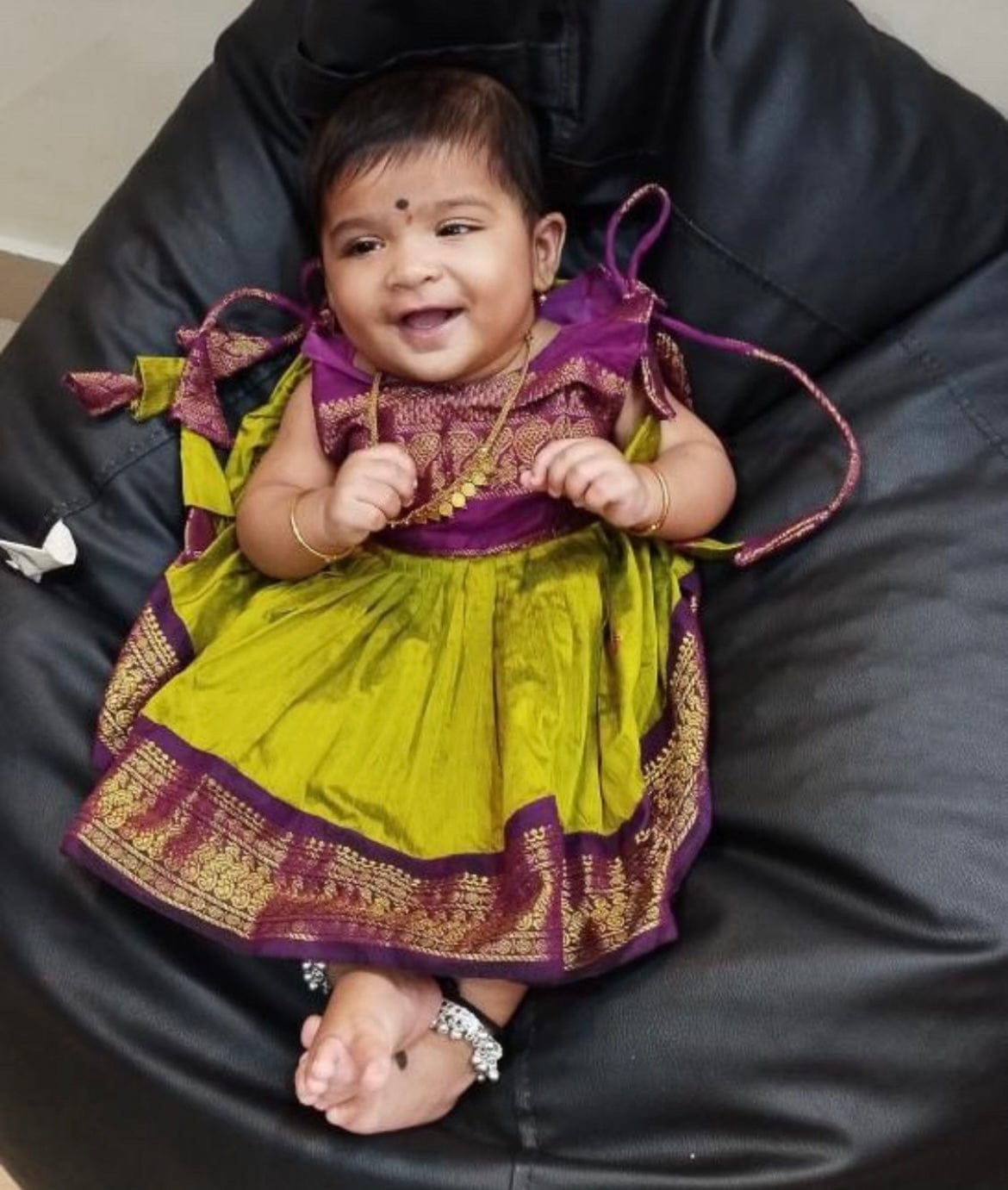 Customer photo review of Green and wine tie up dress for baby girl