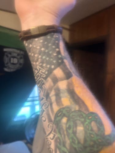 Customer photo review of Don't Tread On Me Leather Bracelet: Helps Pair Veterans With A Service Dog or Shelter Dog