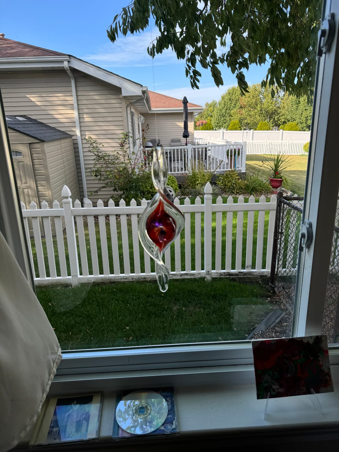 Customer photo review of Dichroic Spinner Suncatcher with Infused Cremains