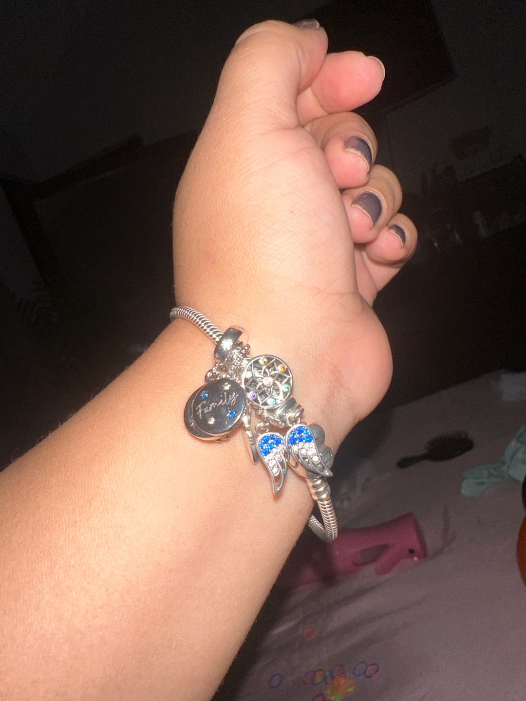 Customer photo review of Charm Alas de Arcangel Diamantadas
