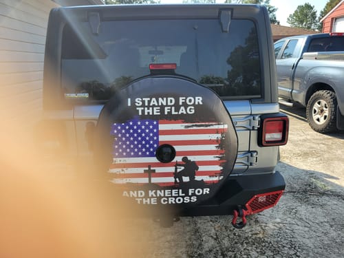Customer photo review of I Stand For The Flag and Kneel For The Cross Spare Tire Cover - Jeep, Bronco, RVs, Campers, Vans, Trailers