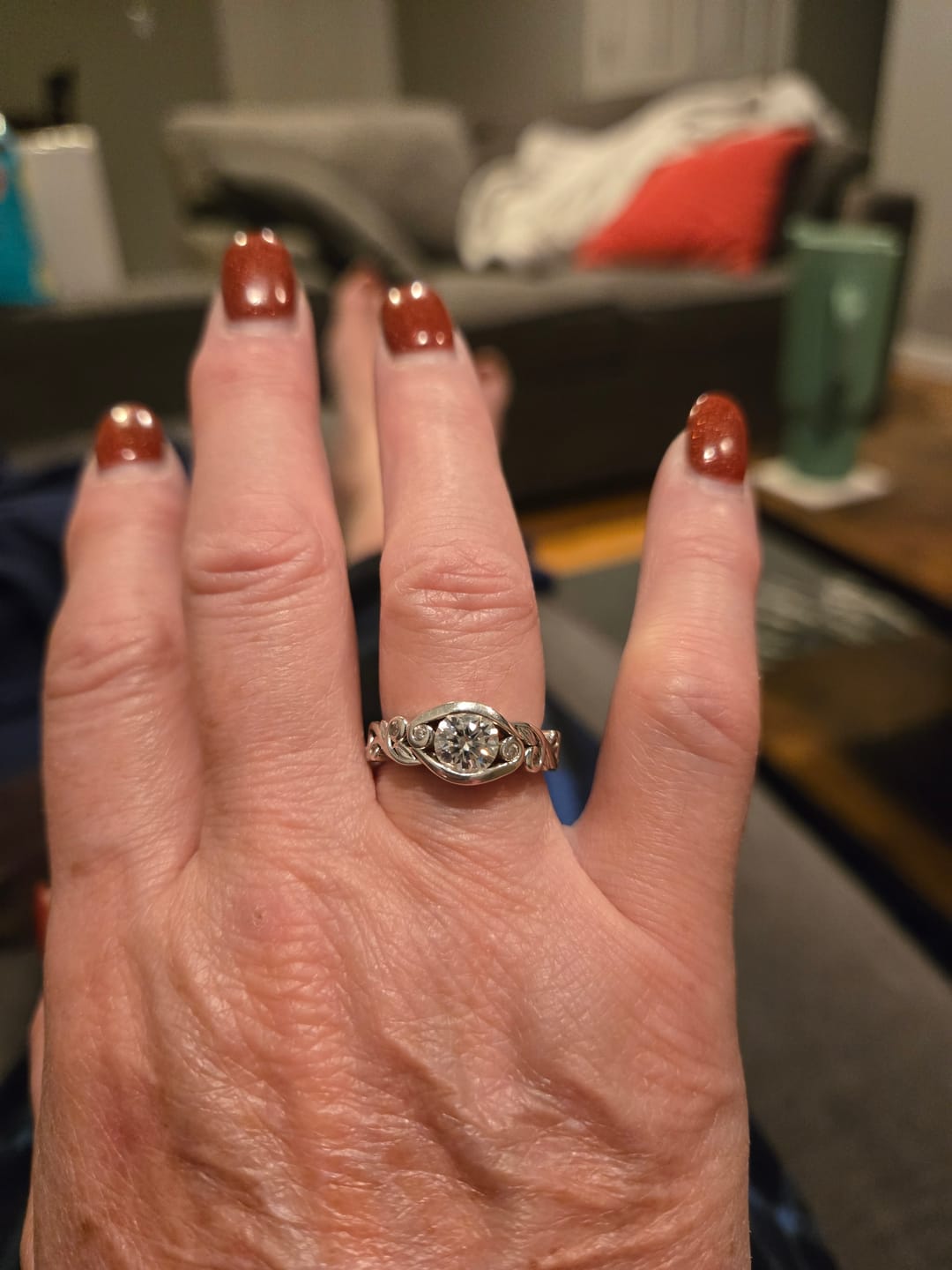 Customer photo review of Bezel Set Round Moissanite Scroll Accents Engagement Ring
