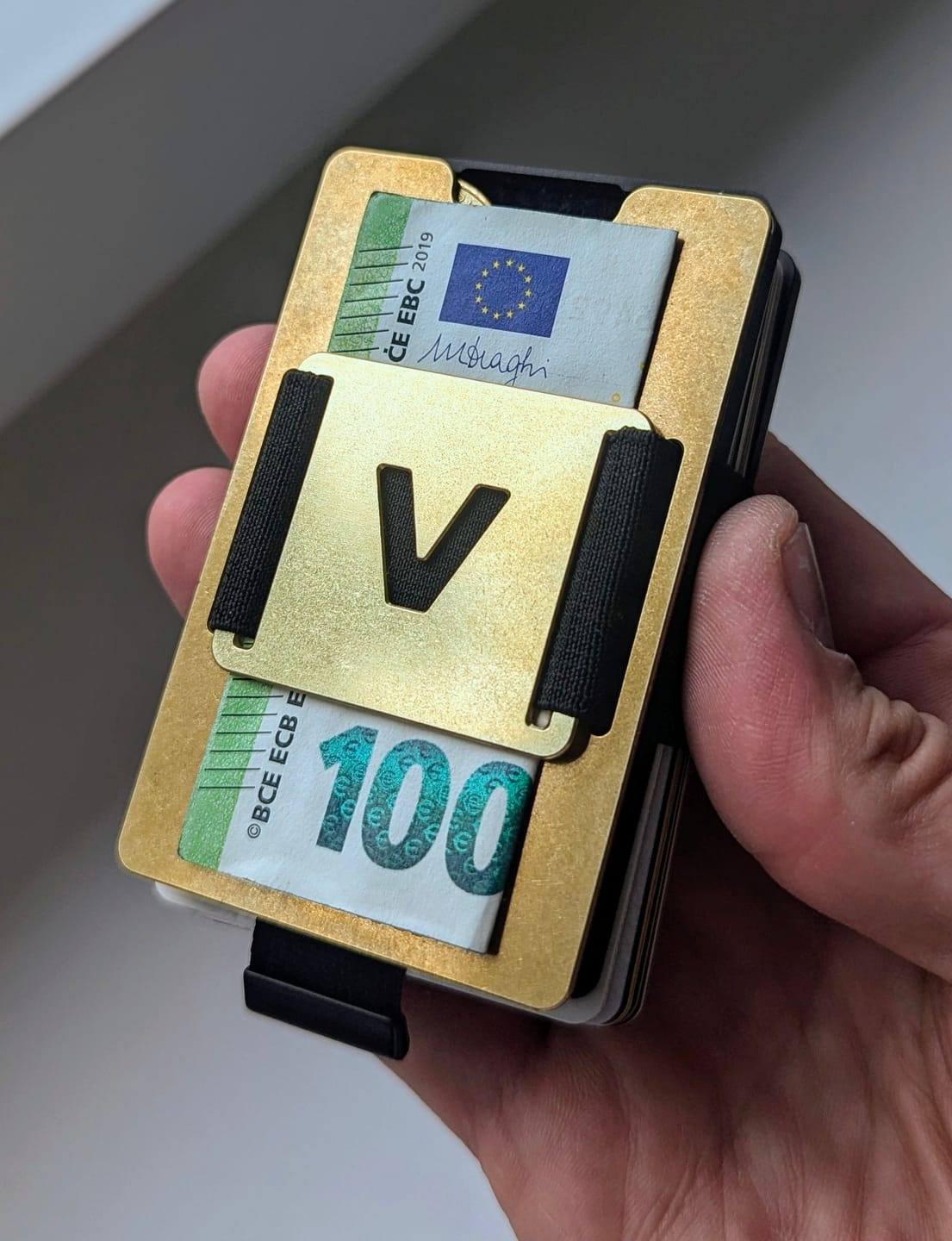 Customer photo review of Stonewashed Brass | Slide Wallet + Brass Cash Clip