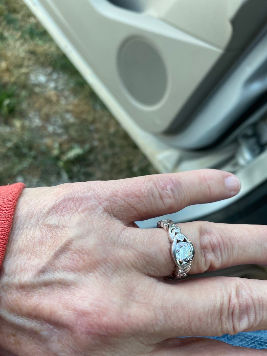 Customer photo review of Bezel Set Round Moissanite Scroll Accents Engagement Ring