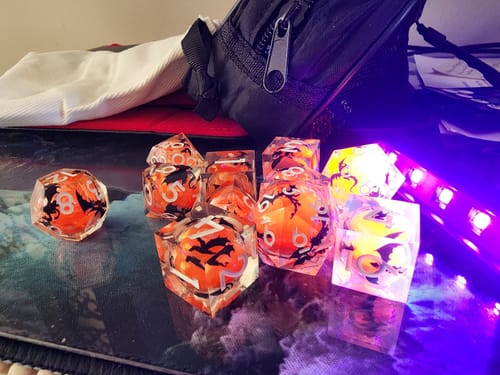 Customer photo review of URWizards D&D Glow in the Dark Liquid Core Resin Engraved Dice Set Dragon
