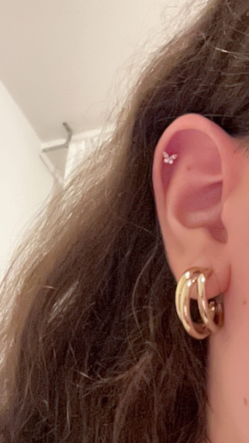 Customer photo review of Butterfly Piercing | Titan