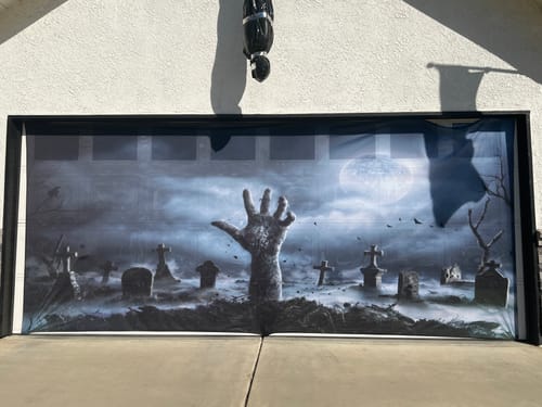 Customer photo review of Zombie Hand Rising Out Of A Graveyard In Spooky Night Garage Door Cover