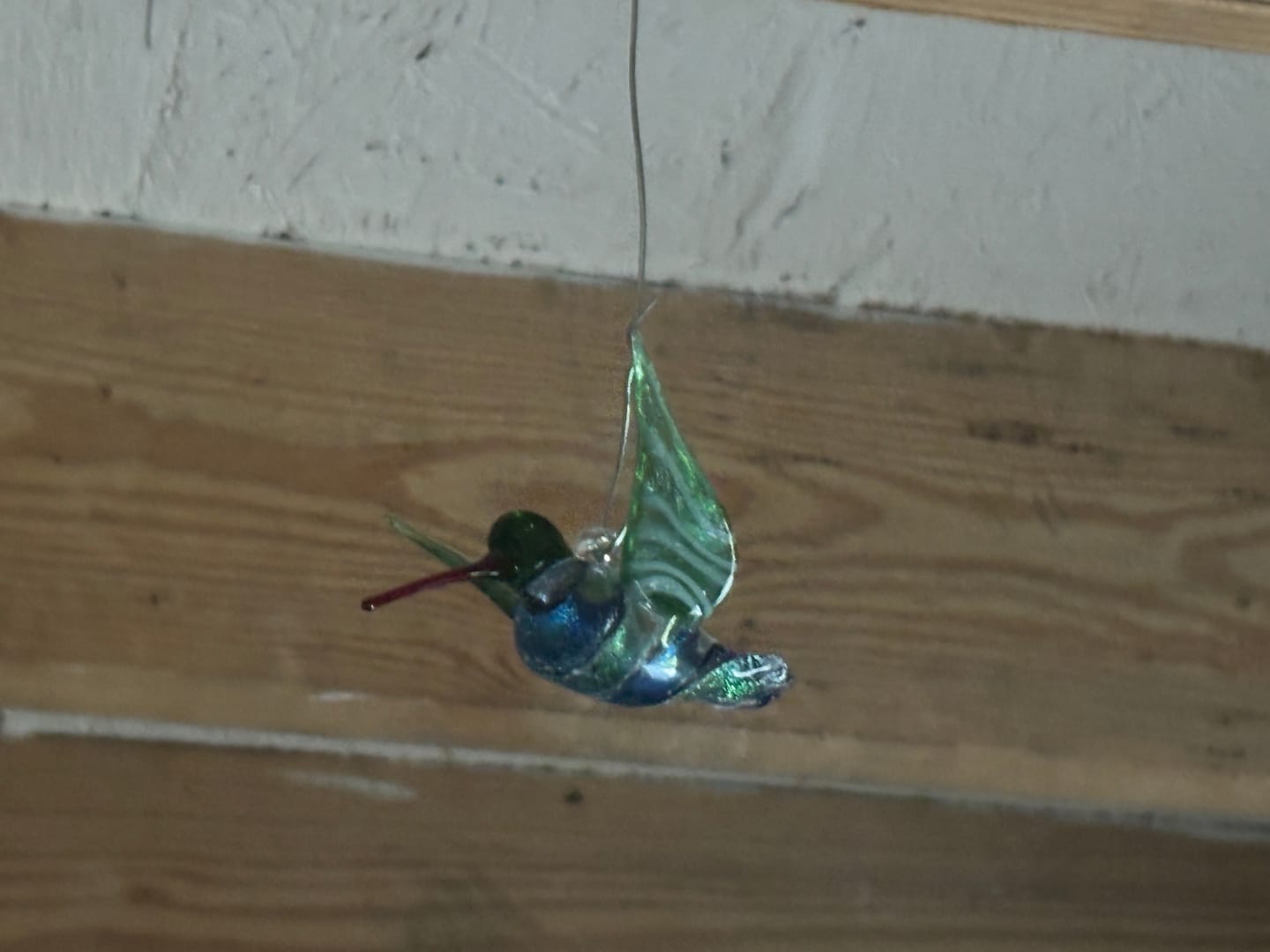 Customer photo review of Dichroic Twist Glass Hummingbird with Infused Ash