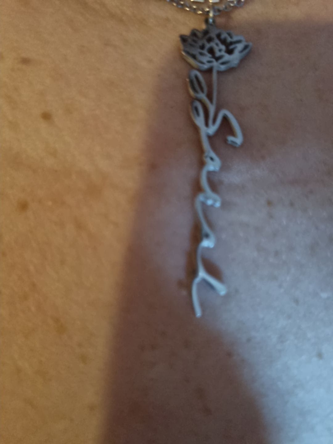 Customer photo review of Custom birth flower name necklace
