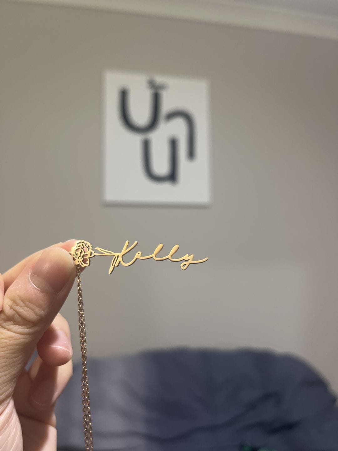 Customer photo review of Custom birth flower name necklace