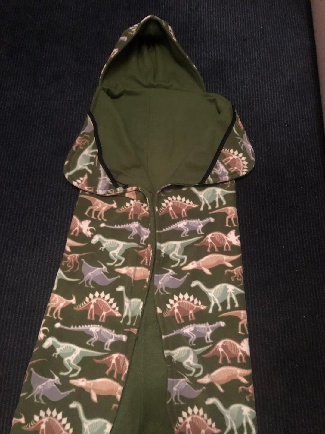 Customer photo review of Dino Skeletons on Green Anti Pill Polar Fleece Fabric