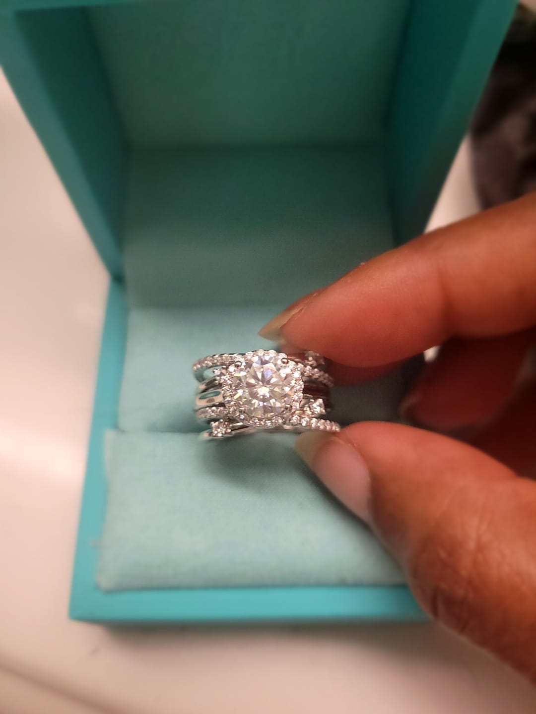 Customer photo review of Halo Moissanite With Enhancer Cross Shank Bridal Engagement Ring Set