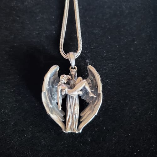Customer photo review of Jesus Wings Necklace