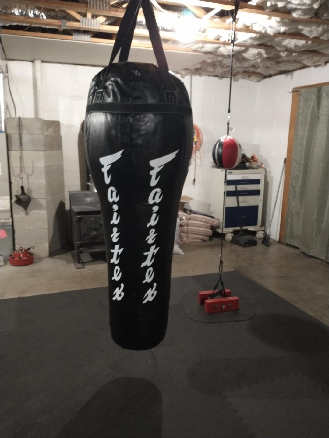 Customer photo review of Fairtex HB12 Angle Bag Punching Bag for Muay Thai, Boxing, Kickboxing, MMA (HB12 Black Unfilled)- 19.7" W x 57.87" H