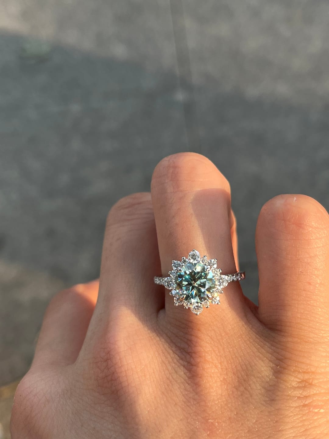 Customer photo review of S925 Moissanite 2 Ct Snowflake Design Halo Round Cyan Blue Stone Engagement Ring