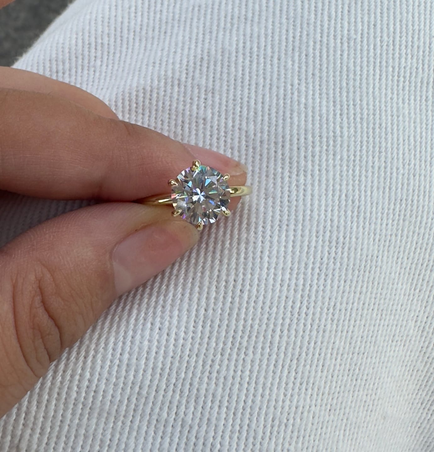 Customer photo review of S925 Moissanite/ Simulated Diamond 2.0 Carat Round Cut Solitaire Engagement Ring In Sterling Silver