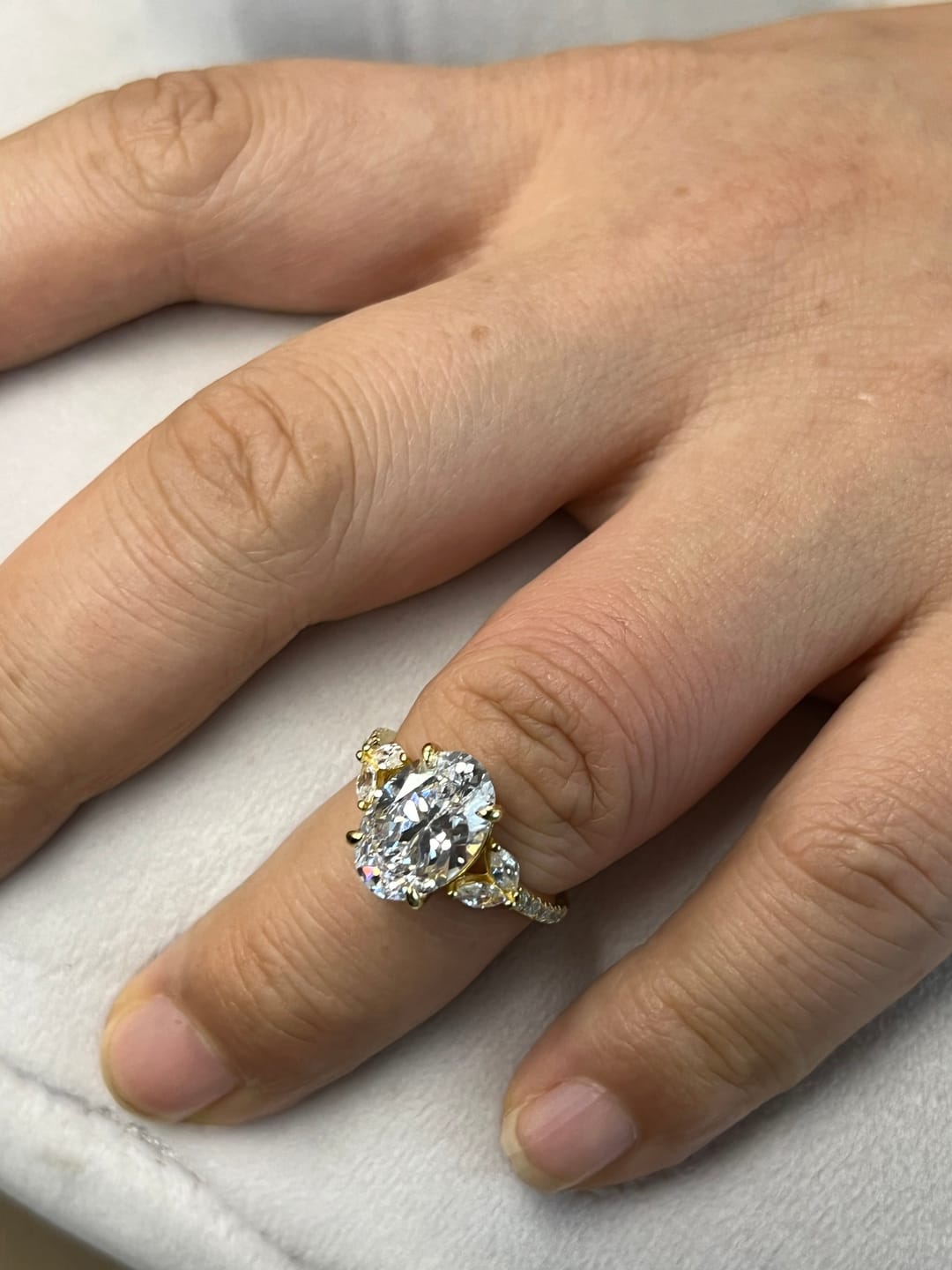 Customer photo review of Louily Sparkle Five Stone Yellow Gold Oval Cut Engagement Ring In Sterling Silver