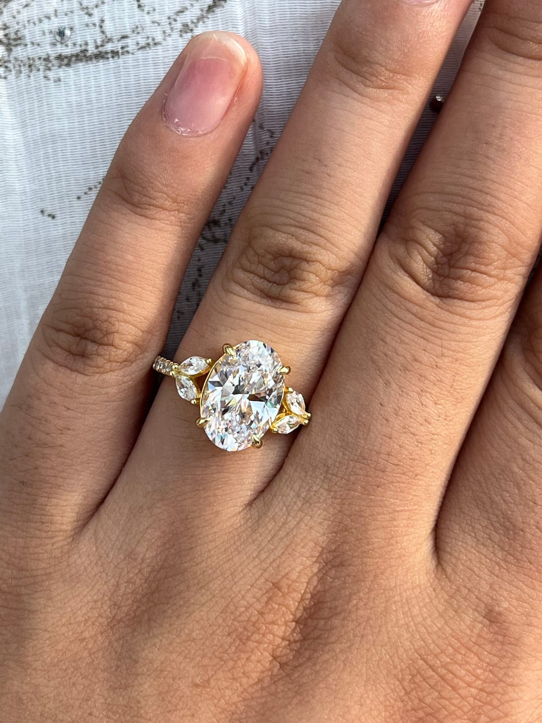 Customer photo review of Louily Sparkle Five Stone Yellow Gold Oval Cut Engagement Ring In Sterling Silver