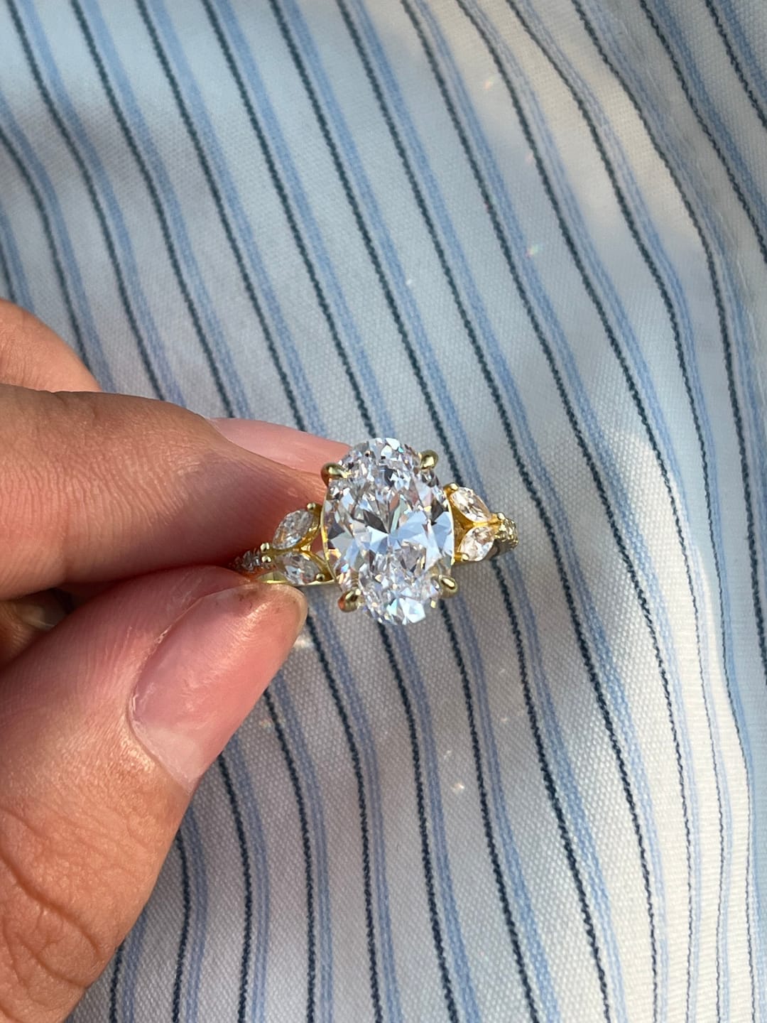 Customer photo review of Louily Sparkle Five Stone Yellow Gold Oval Cut Engagement Ring In Sterling Silver
