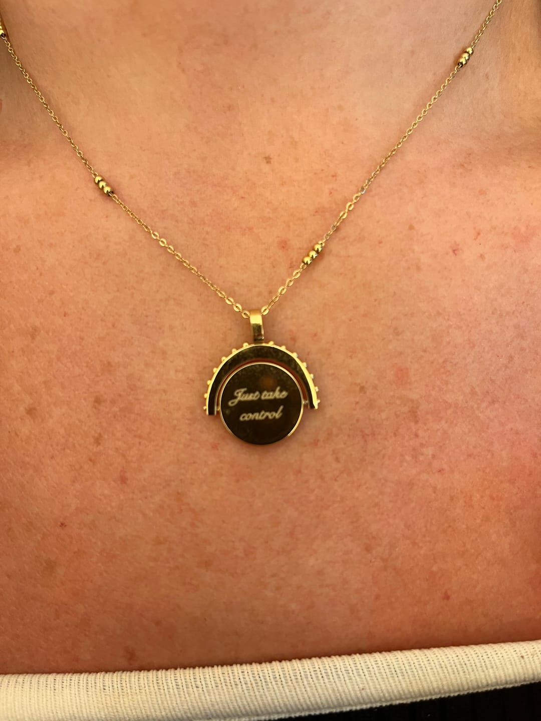 Customer photo review of Engravable Spinning Necklace