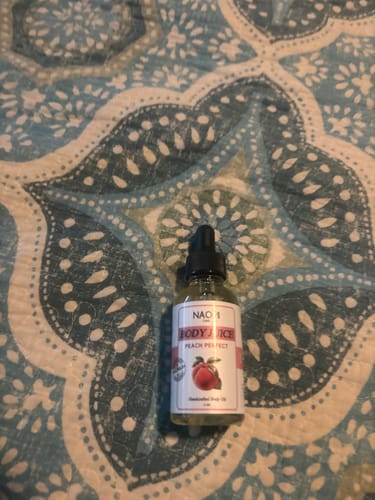 Customer photo review of BOGO Naomi Body Juice Oil