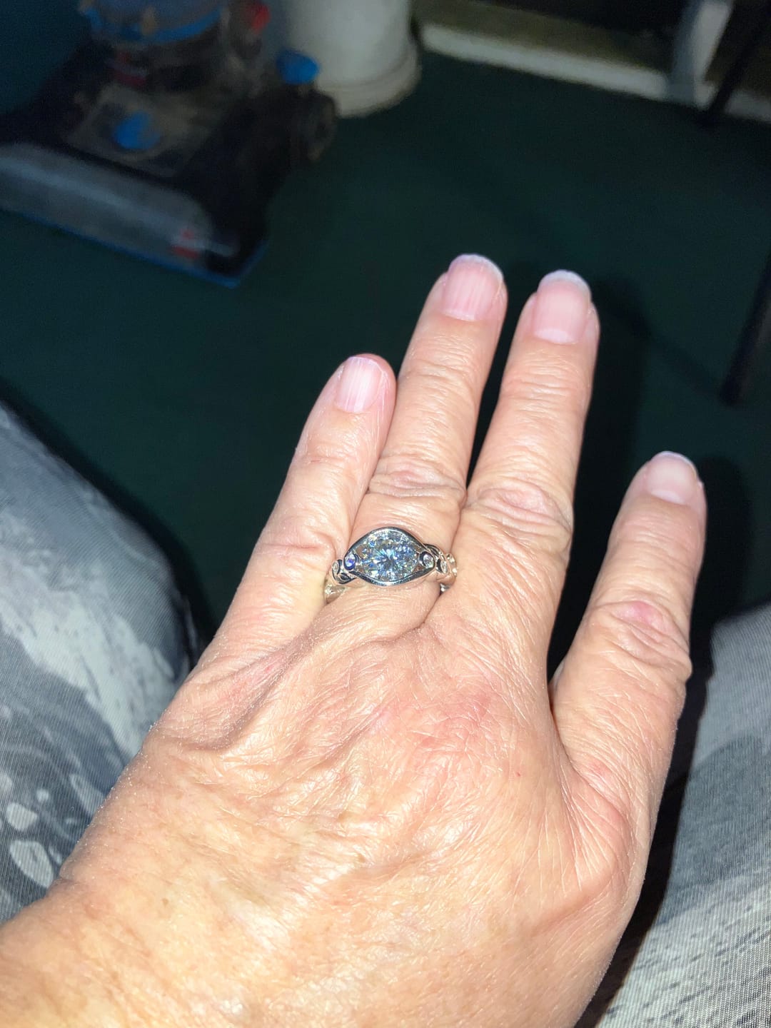 Customer photo review of Bezel Set Round Moissanite Scroll Accents Engagement Ring