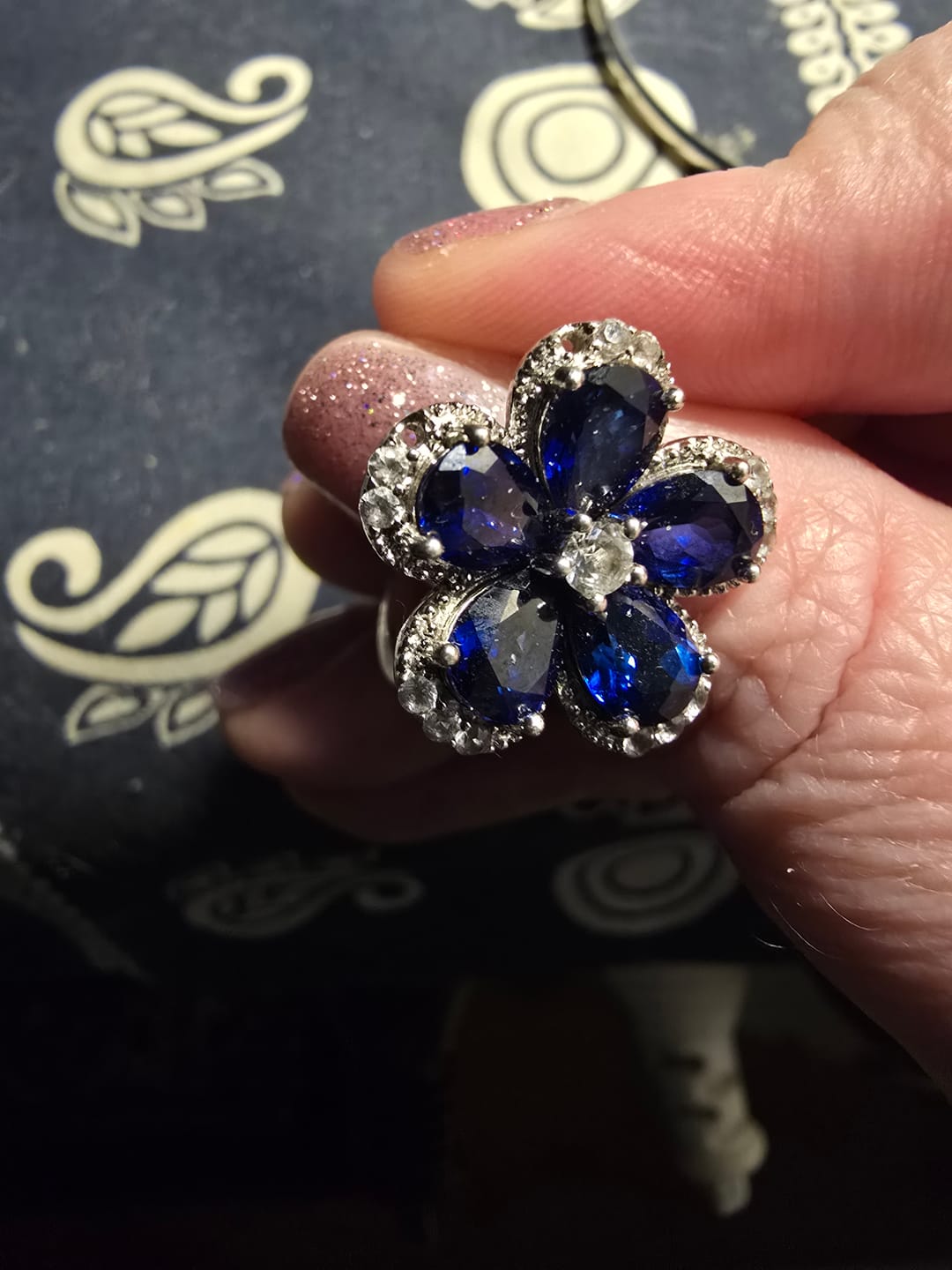 Customer photo review of Five Petal Halo Pear Sapphire Flower Ring In Sterling Silver