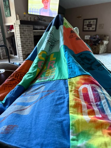 T-shirt quilt with sports, music themes by Donna from OK