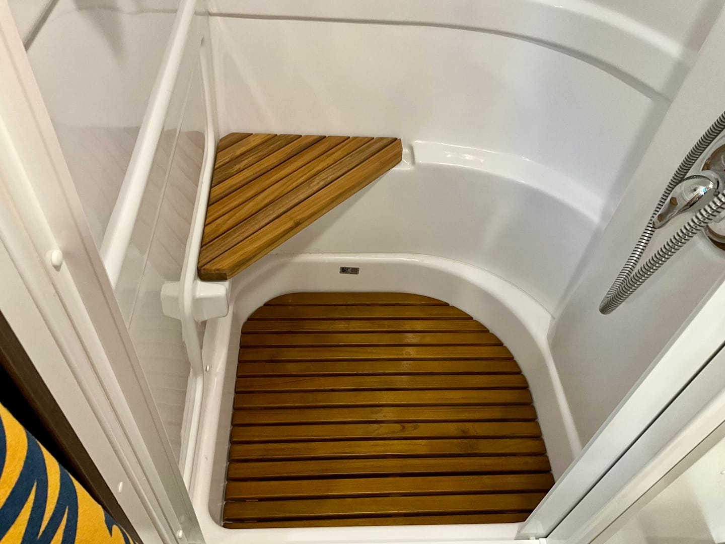 Customer photo review of Corner Bath Airstream Teak Shower Mat (2021 and later)