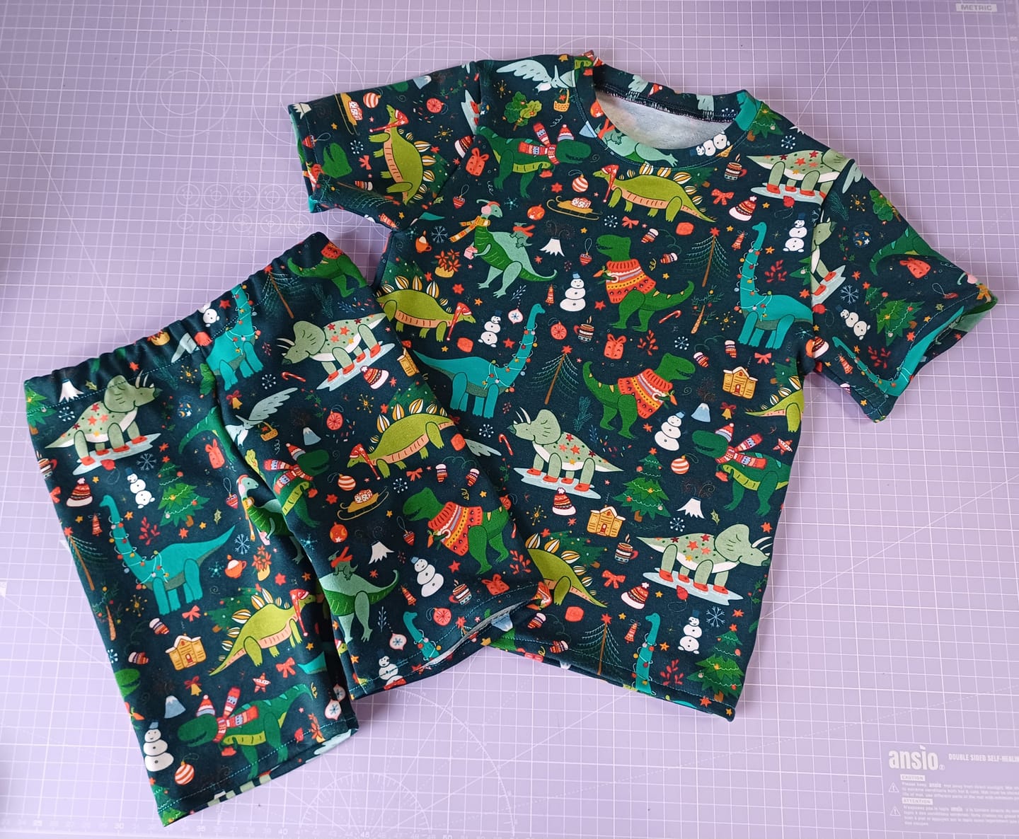 Customer photo review of Christmas Dinosaurs on Dark Teal French Terry Fabric