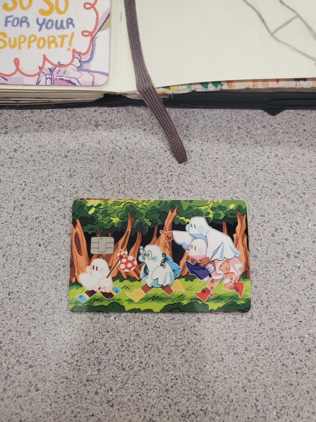 Customer photo review of Runaway Ghosts Credit Card Skins