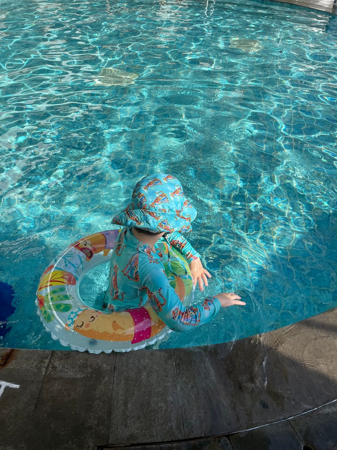 Customer photo review of Shimmering Cheetah Unisex Long Sleeve Zip Swimmers