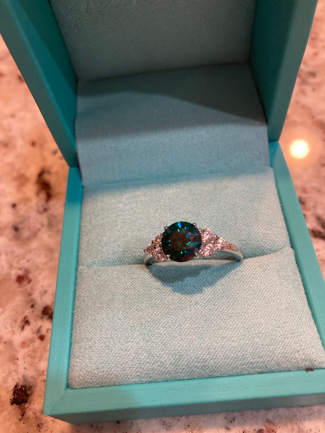 Customer photo review of Green Moissanite Side Stone Engagement Ring